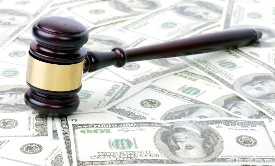 Gavel on pile of money