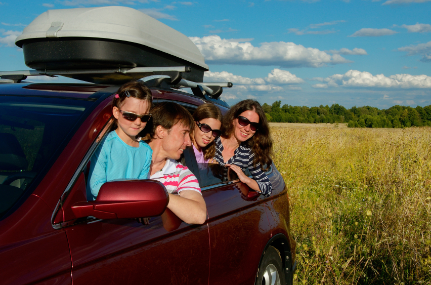 Family in car on road trip
