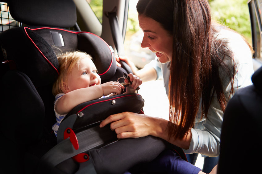 Buckling baby in car seat